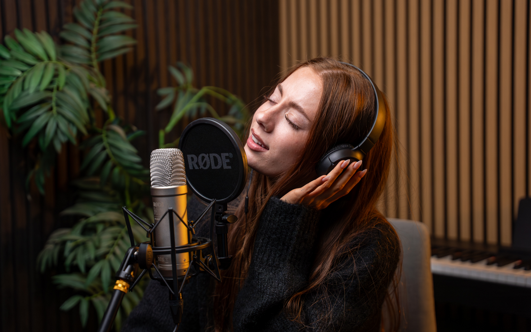 VV Podcast Studio gallery image of a guest singing in the studio