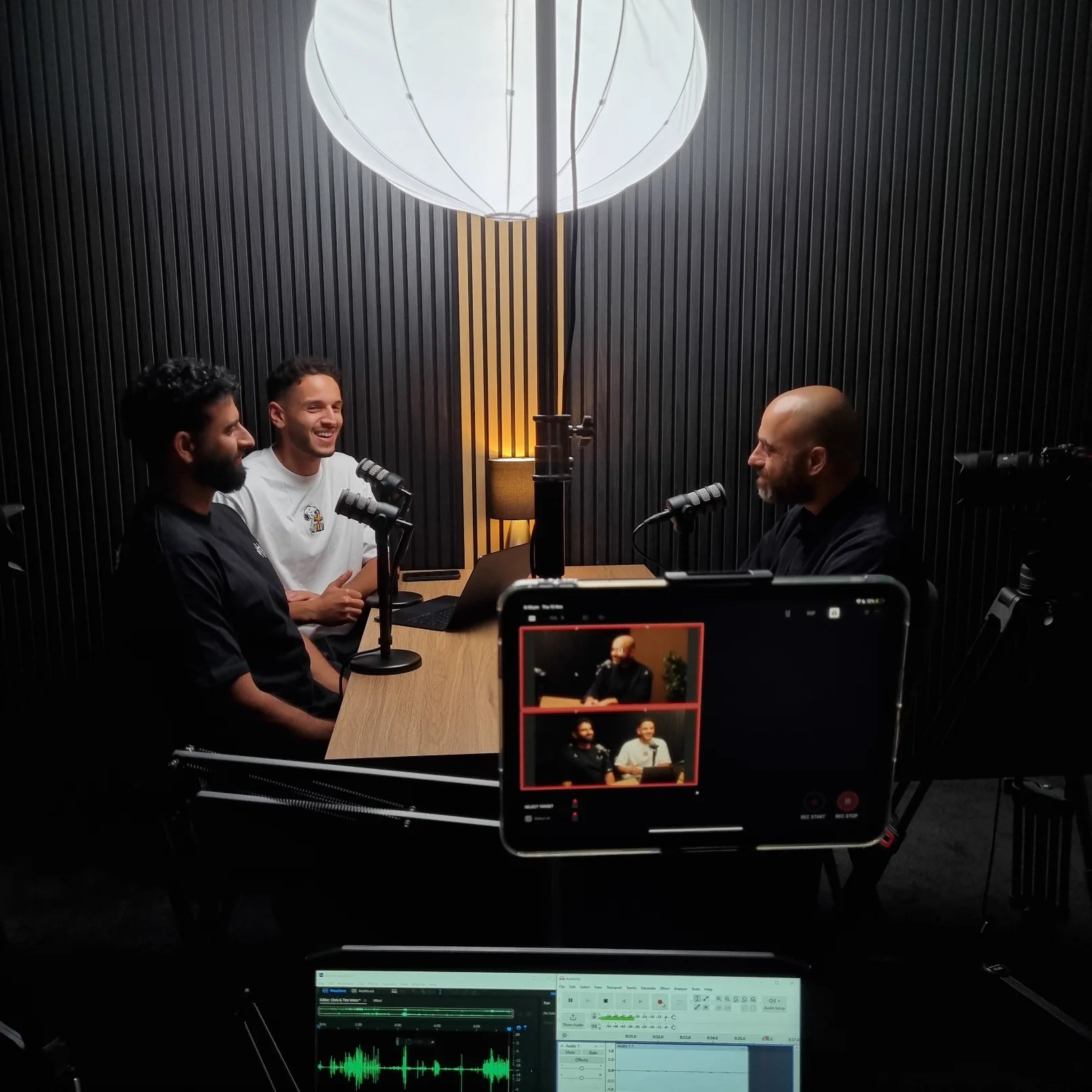 Three person podcast recording table setup at VV Studios Sydney